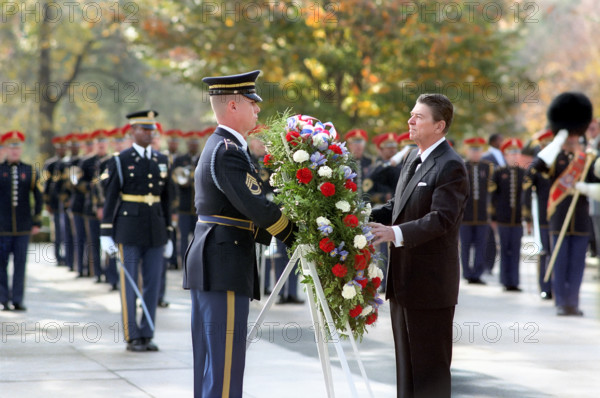 U.S. President Ronald Reagan laying wreath at Tomb of The Unknown Soldier, Arlington National Cemetery, Arlington,  Virginia, USA, President Ronald Reagan White House Photographic Office, November 11, 1985
