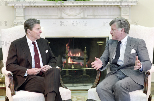 U.S. President Ronald Reagan meeting with U.S. Senator Edward "Ted" Kennedy in Oval Office, White House, Washington, D.C., USA, President Ronald Reagan White House Photographic Office, January 27, 1986