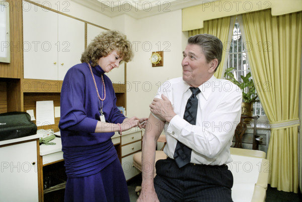 U.S. President Ronald Reagan getting a shot in White House doctors office, Washington, D.C., USA, President Ronald Reagan White House Photographic Office, March 12, 1986