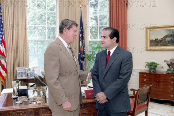U.S. President Ronald Reagan meeting with Judge Antonin Scalia, Reagan's nominee for Associate Justice of the U.S. Supreme Court, White House  Oval Office, Washington, D.C., USA, President Ronald Reagan White House Photographic Office, July 7, 1986