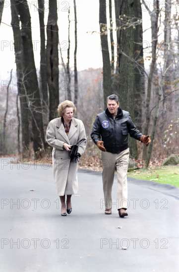 U.S. President Ronald Reagan walking with British Prime Minister Margaret Thatcher at Camp David, Frederick County, Maryland, USA, President Ronald Reagan White House Photographic Office, November 15, 1986