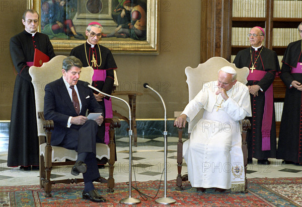 U.S. President Ronald Reagan visiting with Pope John Paul II in library of The Vatican Pontifical Palace during visit to Italy, President Ronald Reagan White House Photographic Office, June 6, 1987