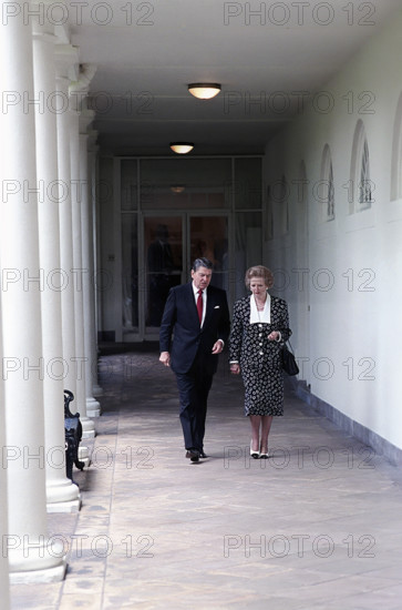 U.S. President Ronald Reagan and British Prime Minister Thatcher walking along White House Colonnade, Washington, D.C., USA, President Ronald Reagan White House Photographic Office, July 17, 1987