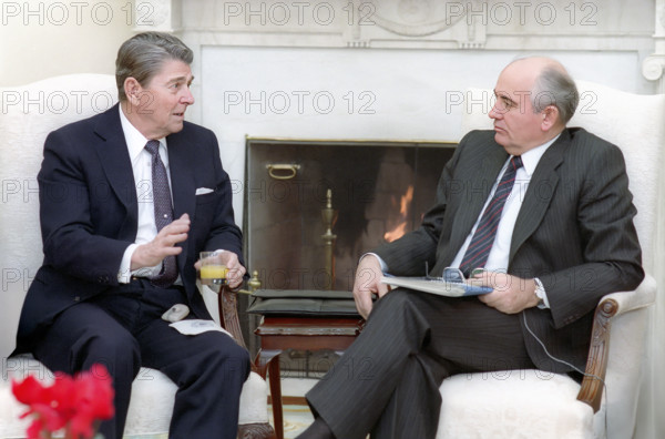 U.S. President Ronald Reagan and Soviet General Secretary Mikhail Gorbachev having their first meeting in the White House Oval Office, Washington, D.C., USA, President Ronald Reagan White House Photographic Office, December 8, 1987