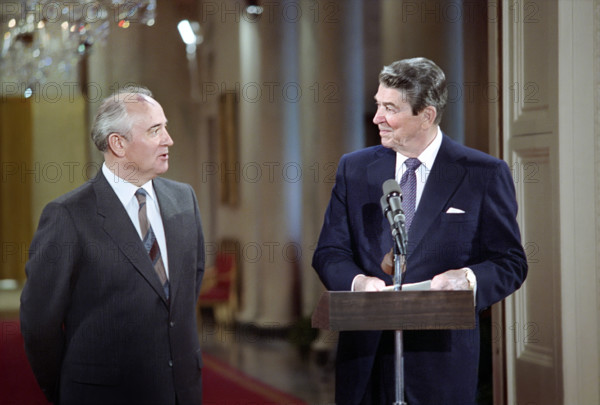 U.S. President Ronald Reagan and Soviet General Secretary Mikhail Gorbachev at podium during Washington Summit and state visit, White House East Room, Washington, D.C., USA, President Ronald Reagan White House Photographic Office, December 8, 1987