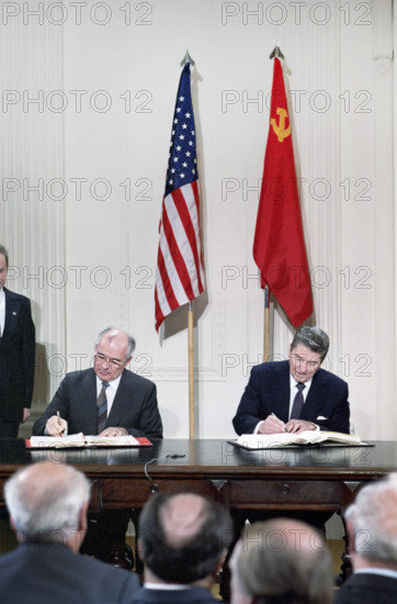 U.S. President Ronald Reagan and Soviet General Secretary Mikhail Gorbachev signing INF Treaty,  White House East Room, Washington, D.C., USA, President Ronald Reagan White House Photographic Office, December 8, 1987