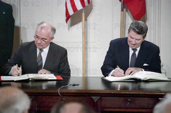 U.S. President Ronald Reagan and Soviet General Secretary Mikhail Gorbachev signing INF Treaty,  White House East Room, Washington, D.C., USA, President Ronald Reagan White House Photographic Office, December 8, 1987