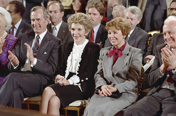 U.S. Vice President George H.W. Bush, U.S. First Lady Nancy Reagan and First Lady of the Soviet Union Raisa Gorbachev at signing of INF Treaty, White House East Room, Washington, D.C., USA, President Ronald Reagan White House Photographic Office, December 8, 1987