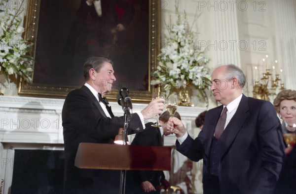 U.S. President Ronald Reagan and Soviet Secretary General Mikhail Gorbachev toast during State Visit and signing of INF Treaty, White House State Dining Room, Washington, D.C., USA, President Ronald Reagan White House Photographic Office, December 8, 1987