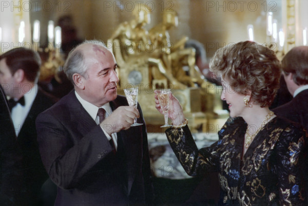 Soviet General Secretary Mikhail Gorbachev and U.S. First Lady Nancy Reagan toasting champagne at Soviet Embassy, Washington, D.C.., USA, President Ronald Reagan White House Photographic Office, December 9, 1987