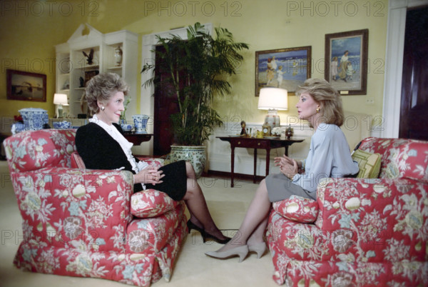 U.S. First Lady Nancy Reagan seated with American journalist Barbara Walters during interview in White House residence, Washington, D.C., USA, President Ronald Reagan White House Photographic Office, February 3, 1988