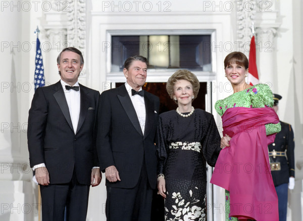 U.S. President Ronald Reagan (2nd left), Prime Minister of Canada Brian Mulroney (left), U.S. First Lady Nancy Reagan (2nd right) and Mila Mulroney (right), White House North Portico before a state dinner, Washington, D.C., USA, President Ronald Reagan White House Photographic Office, April 27, 1988