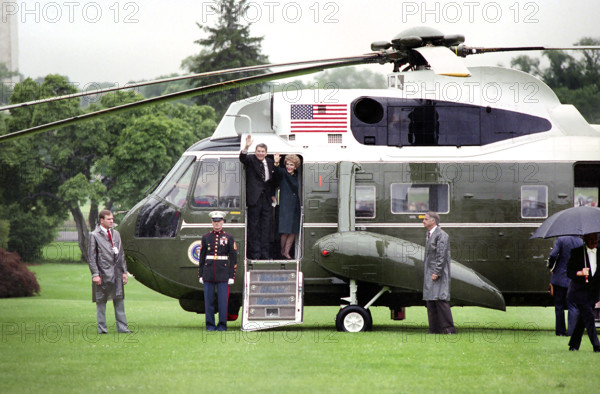 U.S. President Ronald Reagan and U.S. First Lady Nancy Reagan waving from Marine One as they depart from White House South Lawn for Europe and Moscow Summit, Washington, D.C., USA, President Ronald Reagan White House Photographic Office, May 25, 1988