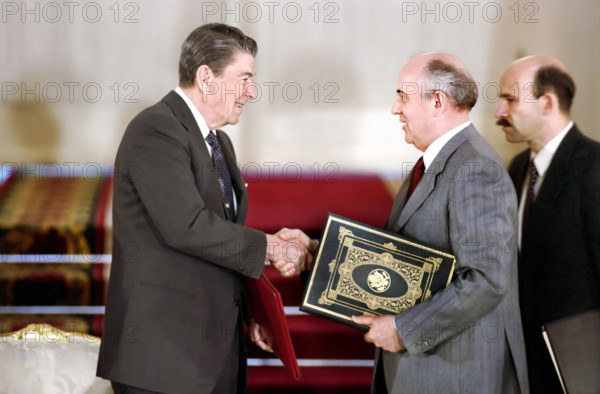 U.S. President Ronald Reagan shaking hands with Soviet General Secretary Mikhail Gorbachev at signing ceremony for the ratification of Intermediate Range Nuclear Forces INF Treaty, Moscow, Russia, USSR, President Ronald Reagan White House Photographic Office, June 1, 1988
