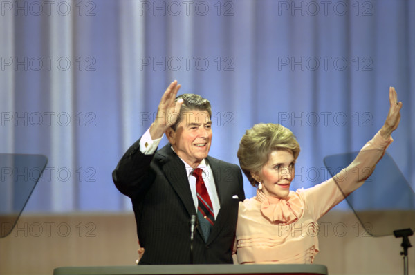 U.S. President Ronald Reagan and U.S. First Lady Nancy Reagan waving to the crowd from podium during 1988 Republican National Convention,  Superdome, New Orleans, Louisiana, USA, President Ronald Reagan White House Photographic Office, August 15, 1988