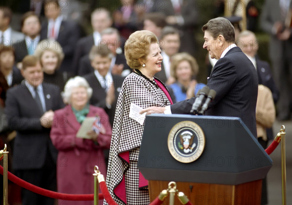 U.S. President Ronald Reagan with British Prime Minister Margaret Thatcher during Thatcher's arrival ceremony on White House South Lawn, Washington, D.C., USA, President Ronald Reagan White House Photographic Office, November 16, 1988