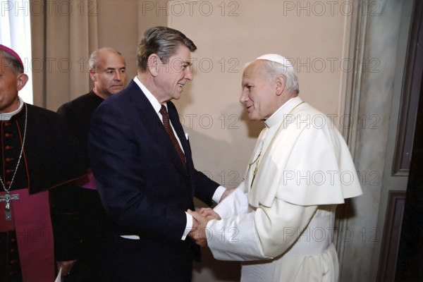 U.S. President Ronald Reagan meeting with Pope John Paul II during visit to papal library, Apostolic Palace, Vatican City, President Ronald Reagan White House Photographic Office, June 7, 1982