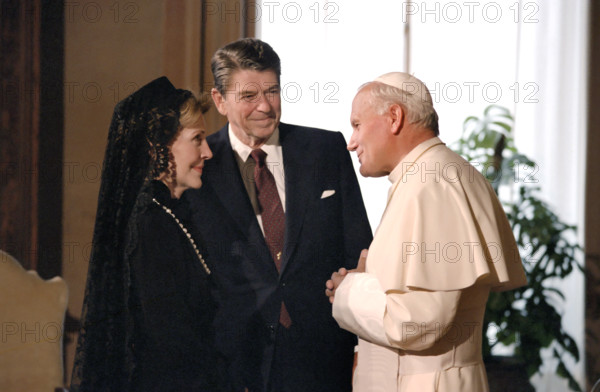 U.S. President Ronald Reagan and U.S. First Lady Nancy Reagan meeting with Pope John Paul II during visit to papal library, Apostolic Palace, Vatican City, President Ronald Reagan White House Photographic Office, June 7, 1982