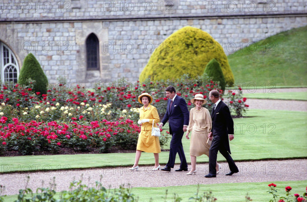 U.S. President Ronald Reagan (2nd left)  and U.S. First Lady Nancy Reagan (2nd right) walking with Prince Philip and Queen Elizabeth II at Windsor Castle, Windsor, Berkshire, England, UK, President Ronald Reagan White House Photographic Office, June 7, 1982
