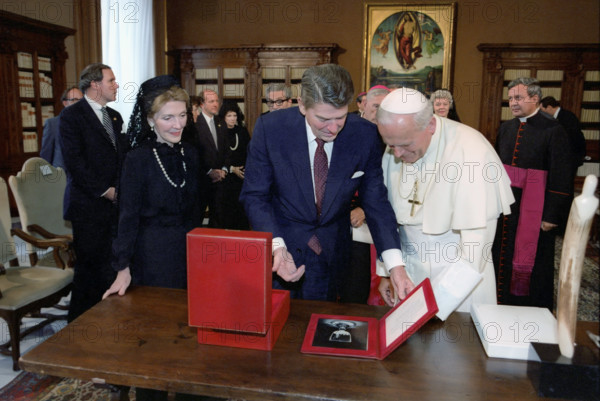 U.S. President Ronald Reagan and U.S. First Lady Nancy Reagan meeting with Pope John Paul II during visit to papal library, Apostolic Palace, Vatican City, President Ronald Reagan White House Photographic Office, June 7, 1982