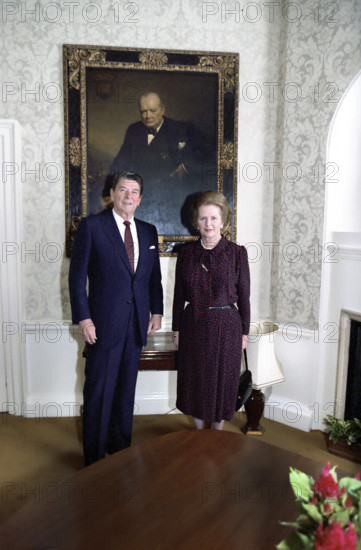 U.S. President Ronald Reagan and British Prime Minister Margaret Thatcher standing in front of painting of Winston Churchill, 10 Downing Street, London, England, UK, President Ronald Reagan White House Photographic Office, June 8, 1982