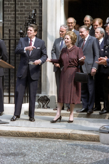 U.S. President Ronald Reagan and British Prime Minister Margaret Thatcher standing in front of 10 Downing Street, London, England, UK, President Ronald Reagan White House Photographic Office, June 8, 1982