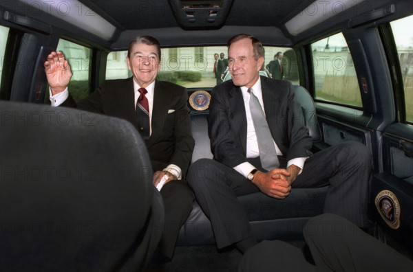 U.S. President Ronald Reagan and U.S. President-elect George H.W. Bush traveling via limousine to United States Capitol on inauguration day, Washington, D.C., USA, President Ronald Reagan White House Photographic Office, January 20, 1989