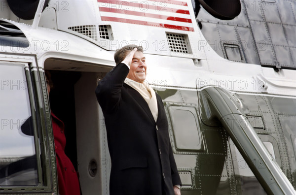 Former U.S. President Ronald Reagan saluting as he departs aboard helicopter as he leaves U.S. Capitol, Washington, D.C., USA, President Ronald Reagan White House Photographic Office, January 20, 1989