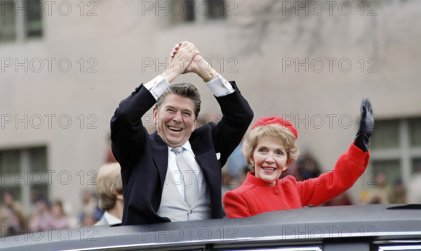 U.S. President Ronald Reagan and U.S. First Lady Nancy Reagan waving from presidential limousine during Inaugural Parade, Washington, D.C., USA, President Ronald Reagan White House Photographic Office, January 20, 1981