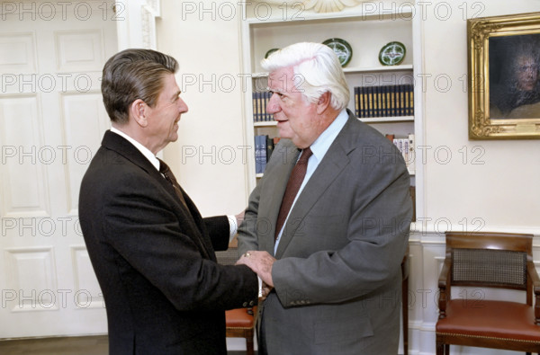 U.S. President Ronald Reagan and Speaker of the U.S. House of Representatives Thomas "Tip" O'Neill greeting each other in the White House Oval Office, Washington, D.C., USA, President Ronald Reagan White House Photographic Office, December 9, 1981