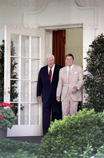 U.S. President Ronald Reagan and Speaker of the U.S. House of Representatives Thomas "Tip" O'Neill walking on the White House Colonnade before press conference regarding federal tax and budget reconciliation, Washington, D.C., USA, President Ronald Reagan White House Photographic Office, August 18, 1982