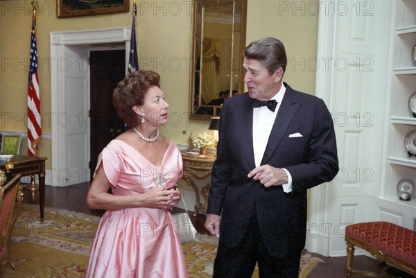 U.S. President Ronald Reagan talking with Princess Margaret of the United Kingdom at a private dinner in her honor, White House private residence, Washington, D.C., USA, President Ronald Reagan White House Photographic Office, October 1, 1983