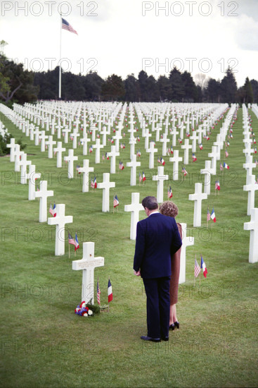 U.S. President Ronald Reagan and U.S. First Lady Nancy Reagan visiting the grave of General Theodore Roosevelt Jr. at Omaha Beach cemetery during 40th anniversary of D-Day Landings, Colleville-sur-Mer, France, President Ronald Reagan White House Photographic Office, June 6, 1984