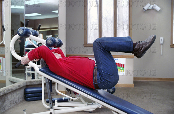 U.S. President Ronald Reagan exercising in gym at Camp David, Frederick County, Maryland, USA, President Ronald Reagan White House Photographic Office, January 16, 1987