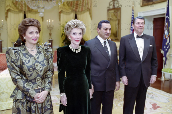 U.S. President Ronald Reagan and U.S. First Lady Nancy Reagan with Egypt President Hosni Mubarak and First Lady Suzanne Saleh Mubarak in White House private residence prior to State Dinner, Washington, D.C., USA, President Ronald Reagan White House Photographic Office, January 28, 1988