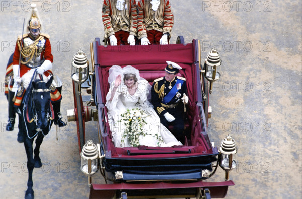 Prince Charles and Princess Diana riding in horse-drawn carriage during their Royal Wedding, high angle view, London, England, UK, President Ronald Reagan White House Photographic Office, July 29, 1981