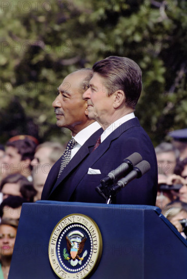 U.S. President Ronald Reagan and Egyptian President Anwar El Sadat on the White House south lawn at the arrival ceremony in honor of Sadat's state visit, Washington, D.C., USA, President Ronald Reagan White House Photographic Office, August 5, 1981