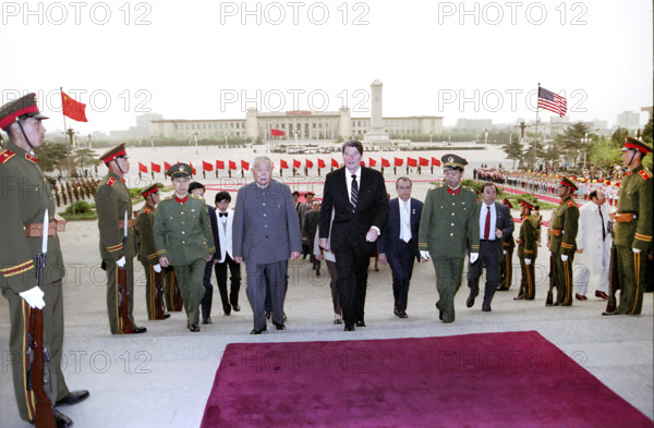 U.S. President Ronald Reagan walking with President of the People's Republic of China  at Reagan's arrival ceremony, Tiananmen Square, Beijing, People's Republic of China, President Ronald Reagan White House Photographic Office, April 26, 1984