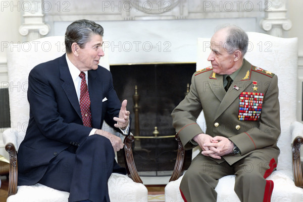 U.S. President Ronald Reagan meeting with Marshal of the Soviet Union Sergey Akhromeyev in the White House Oval Office, Washington, D.C., USA, President Ronald Reagan White House Photographic Office, July 11, 1988