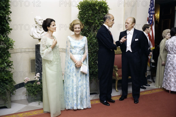 Anne-Aymone Giscard d'Estaing, U.S. First Lady Betty Ford, President Valery Giscard d'Estaing of France, and U.S. President Gerald R. Ford talking at close of receiving line at White House state dinner, Washington, D.C., USA, Gerald R. Ford White House Photographs, May 17, 1976