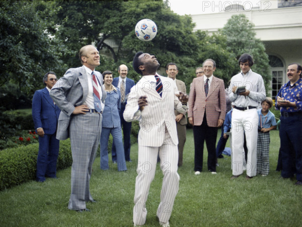 U.S. President Gerald R. Ford watching Pele head a soccer ball in the White House Rose Garden, Washington, D.C., USA, Gerald R. Ford White House Photographs, June 28, 1975