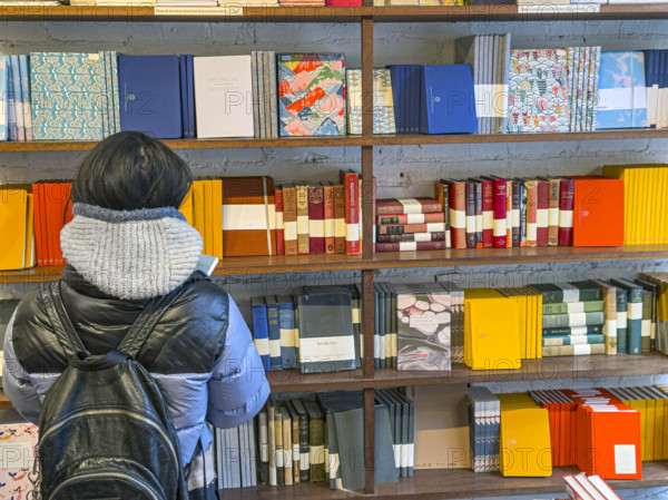 Person shopping for notebooks, Goods For The Study retail store, West Village, Manhattan, New York City, New York, USA