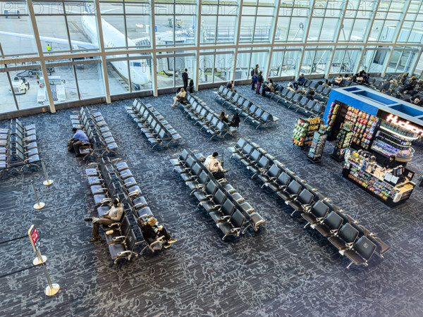 High angle view of travelers relaxing in departure lounge, Delta Airlines, Fort Lauderdale-Hollywood International Airport, Fort Lauderdale, Florida, USA