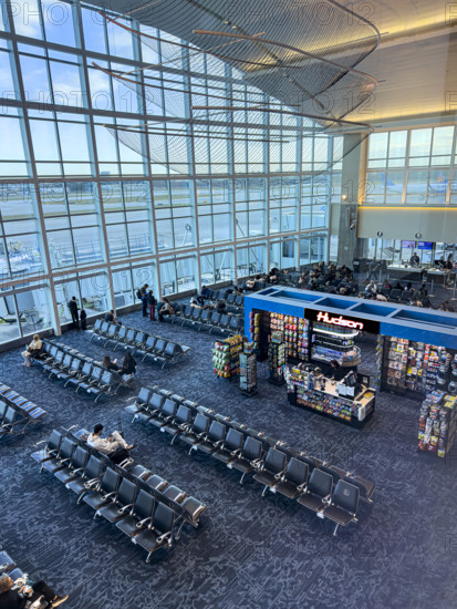 High angle view of travelers relaxing in departure lounge, Delta Airlines, Fort Lauderdale-Hollywood International Airport, Fort Lauderdale, Florida, USA