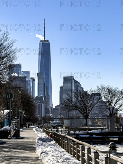 One World Trade Center and cityscape of Financial District in winter viewed from Hudson River Park, Manhattan, New York City, New York, USA