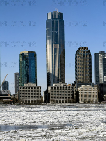View of Jersey City, New Jersey, USA skyline with 99 Hudson Street (center) across frozen Hudson River