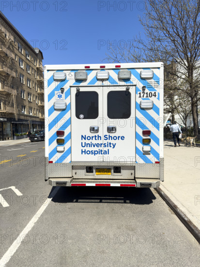 Rear view of North Shore University Hospital Northwell Health EMS ambulance parked on urban street, Chelsea, Manhattan, New York City, New York, USA