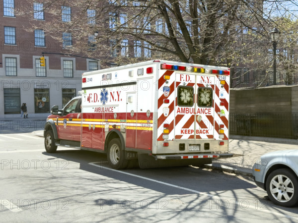 New York City Fire Department EMS ambulance parked on urban street, Chelsea, Manhattan, New York City, New York, USA