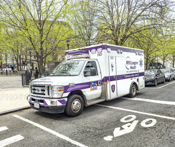 NYU Langone Health EMS ambulance parked on urban street, Chelsea, Manhattan, New York City, New York, USA