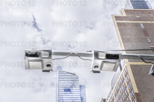 Low angle view of congestion pricing scanners with cityscape in background, Hudson Yards, New York City, New York, USA